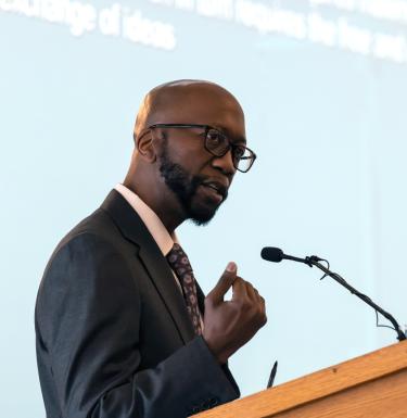 person speaking at the podium